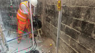 Geobear tech working at foundation of boundary wall