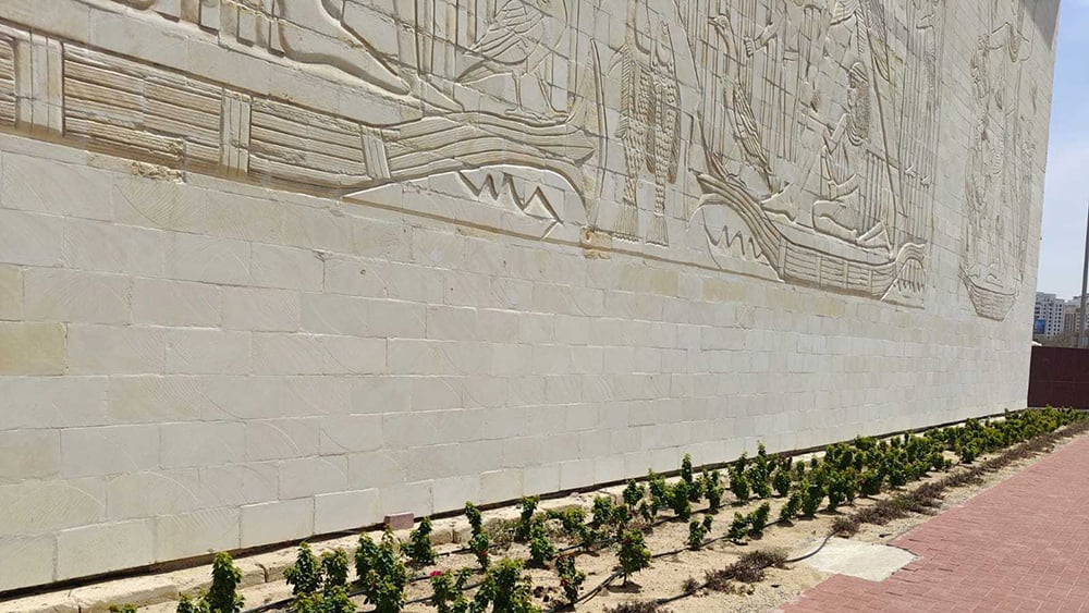 Exterior view of Wafi mall wall and the landscaping along the bottom of the wall
