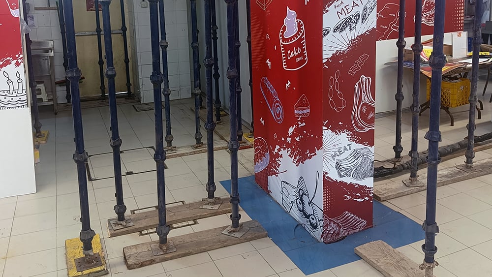 view of foundation supports on tile floor in a mall