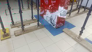 view of structural supports in shopping mall on tile floor