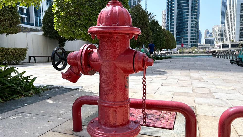 view of UAE red fire hydrant in an urban street environment
