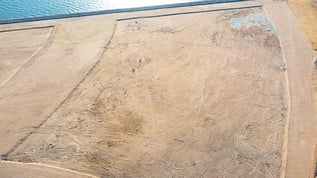 Aerial view of reclaimed land next to the sea