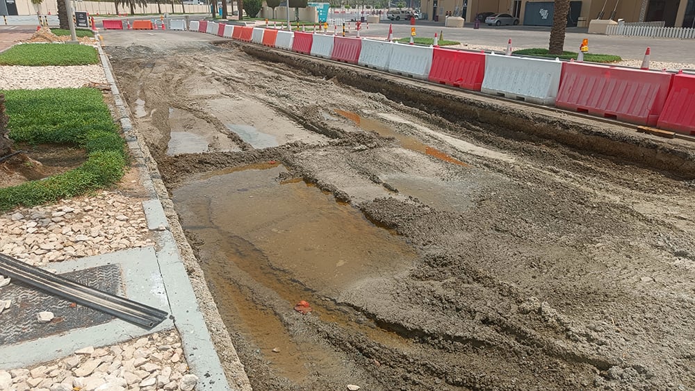 UAE road work with puddle water