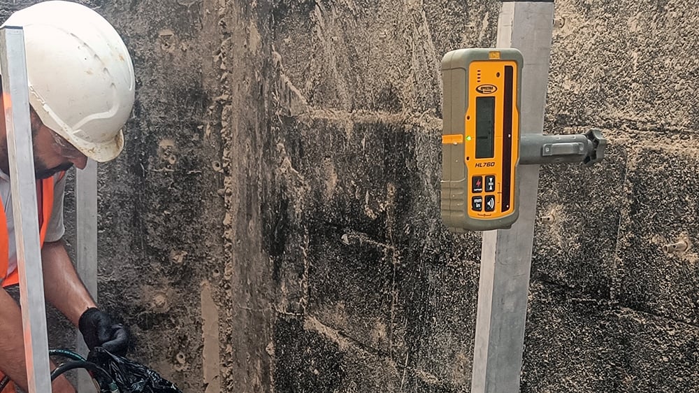 Laser level receiver on a stand at home subsidence treatment