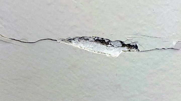 Closeup of ground settlement cracking in a private villa internal wall