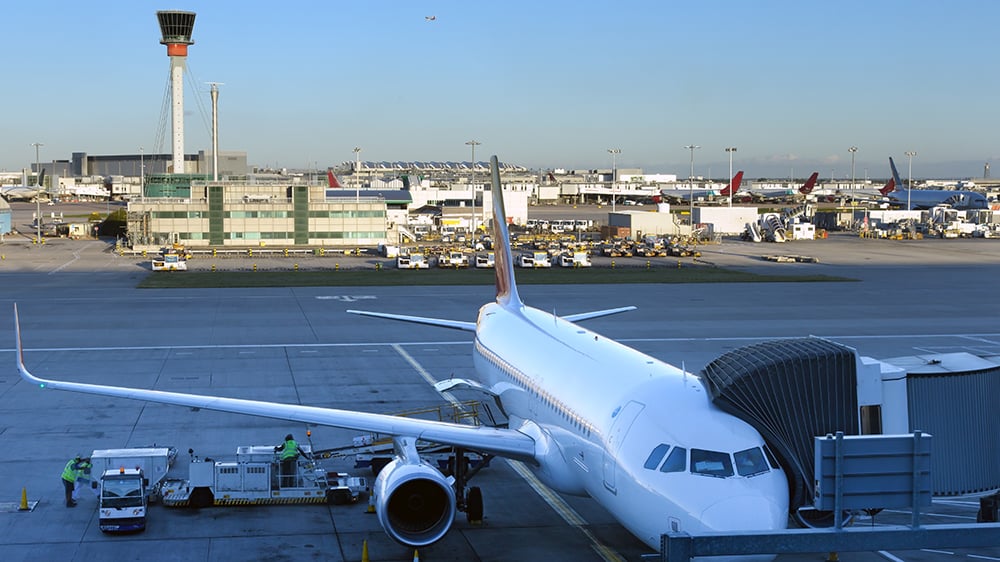 view of commercial aircraft at a gate at LHR