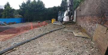 Listed wall protected, weakened ground & voids repaired