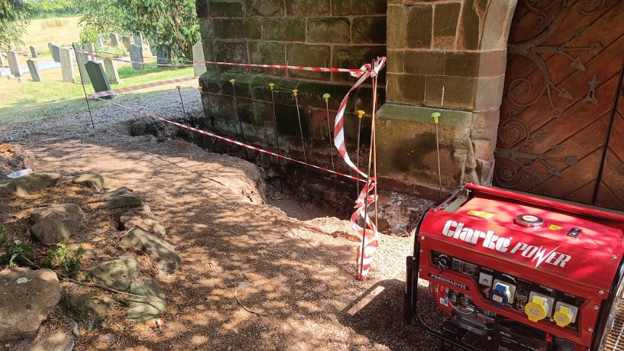 A series of injection points with safety barrier and generator at exterior of St. Mary's Church