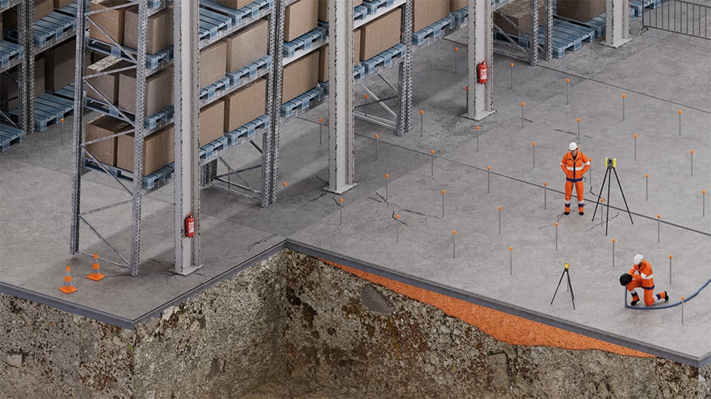 3D view of exposed soil under concrete slab in warehouse with Geobear techs injecting geopolymer
