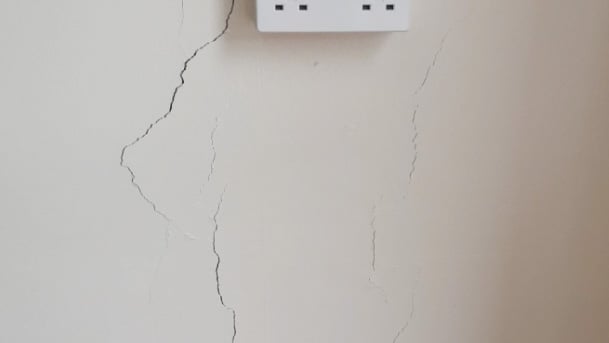 Vertical cracks in an interior wall of a residential home