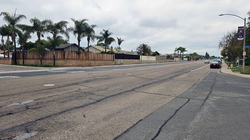 View of cracking pavement above sewer lines