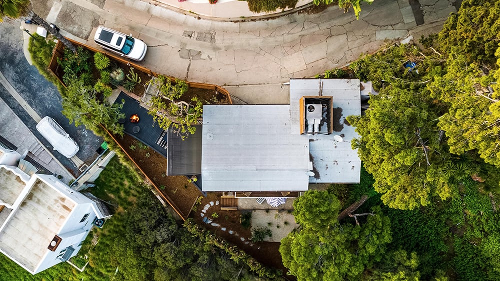 Aerial view of a Southern California home with road in front