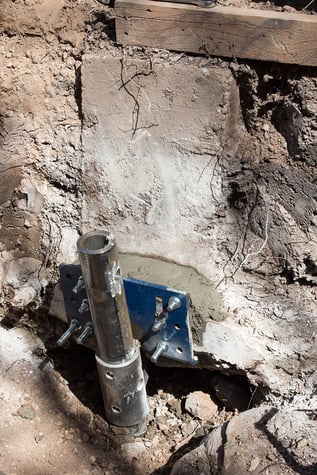 Installed push pile connected to foundation